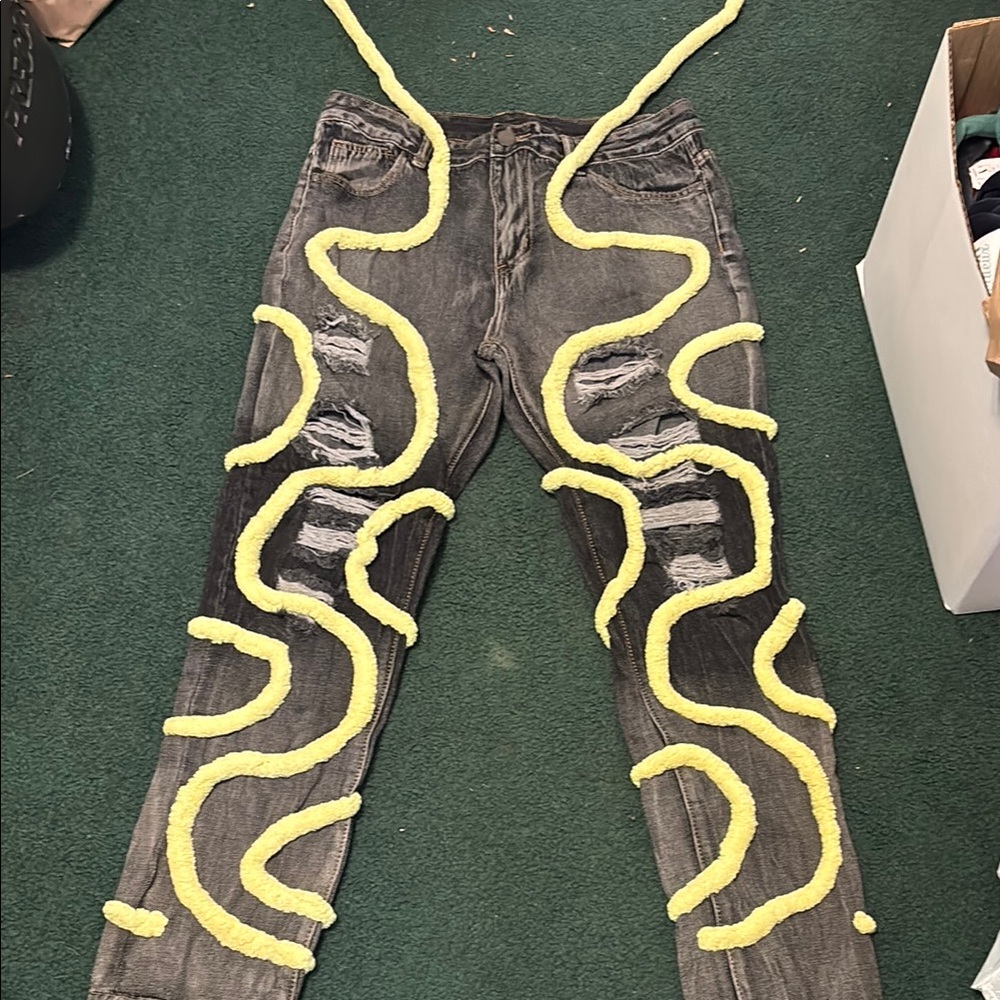 Stylish Distressed Gray Jeans with Yellow Accents